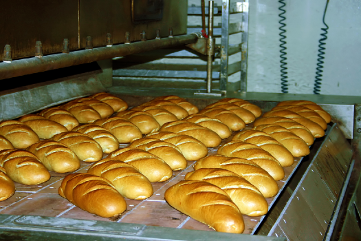 bread coiming out of the oven 